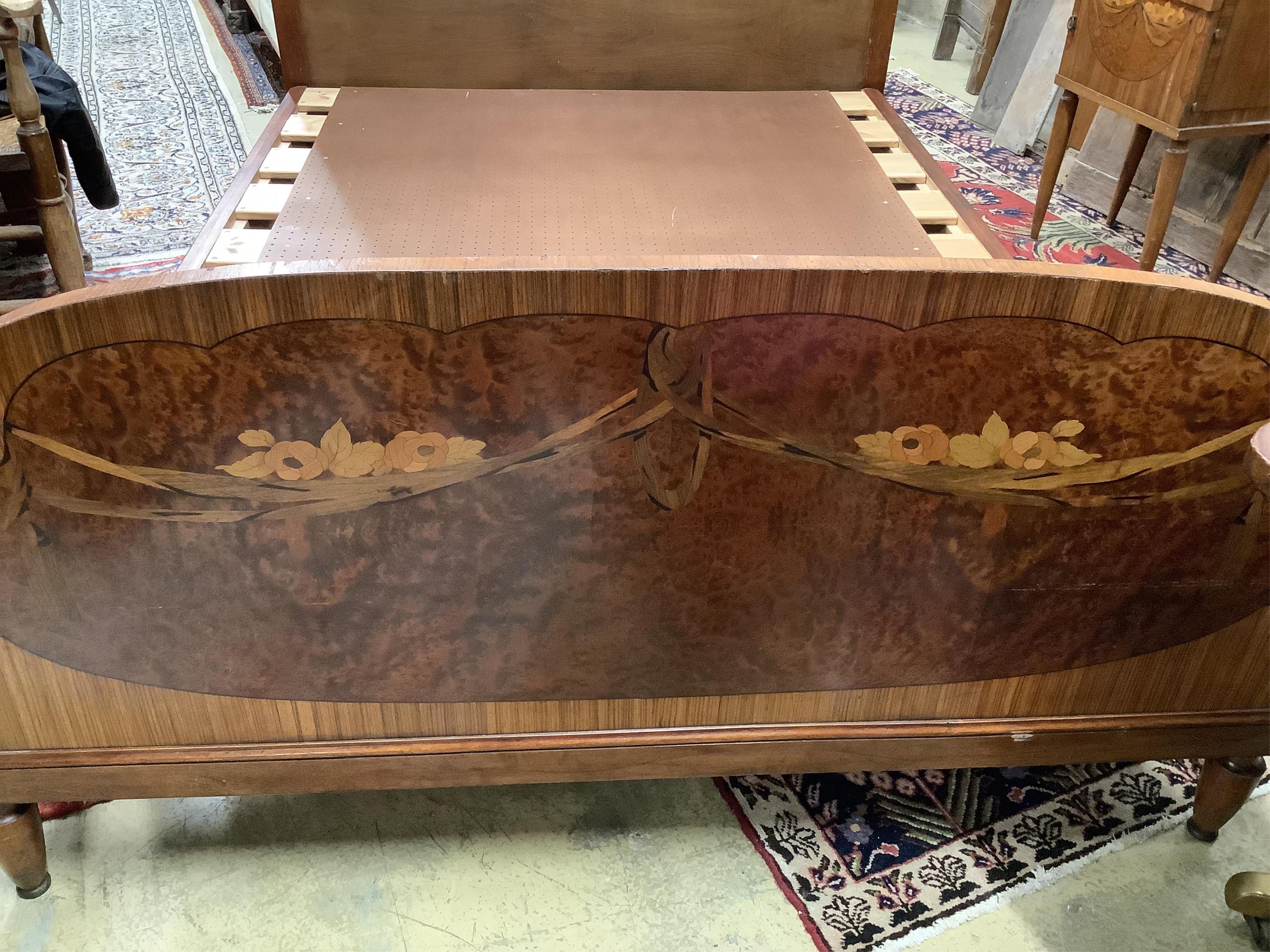 A French Art Deco walnut, amboyna and marquetry kingsize bed and a matching bedside cupboard, width 150cm, length 208cm, height 140cm. Condition - fair to good